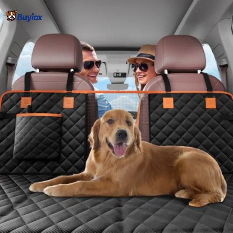 Golden retriever relaxing on quilted dog back seat cover with mesh barrier for safer car rides