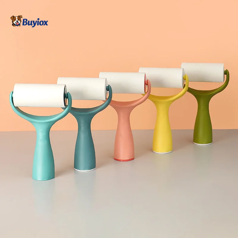 Reusable lint roller and rubber pet hair brush placed side-by-side on a clean surface.