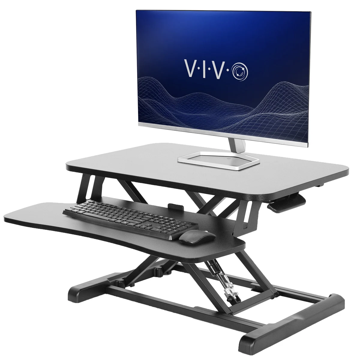 VIVO DESK-V000K 32 standing desk converter with dual monitors in a home office