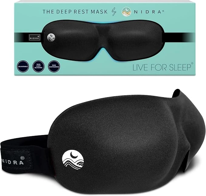 Nidra Deep Rest contoured eye mask in black with branded box, showing the Nidra wave logo