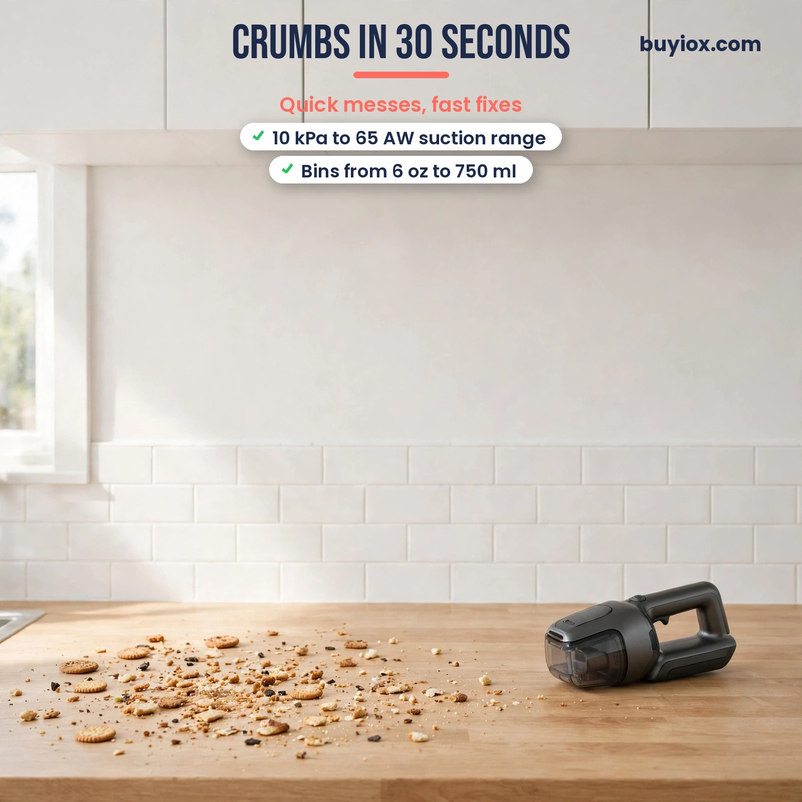 Handheld vacuum cleaning crumbs from a kitchen counter